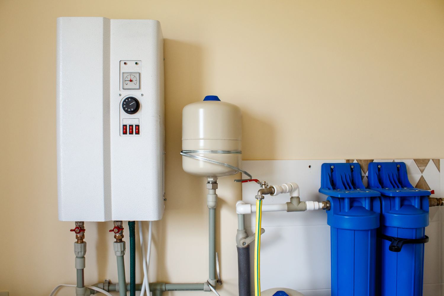 Tankless water heater mounted on the wall of a home