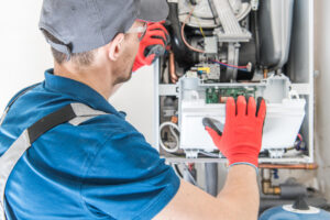 HVAC technician installing a residential furnace