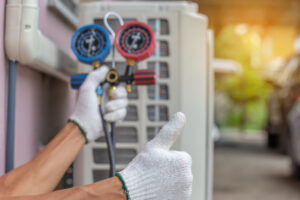 Air conditioner technician inspecting an AC unit